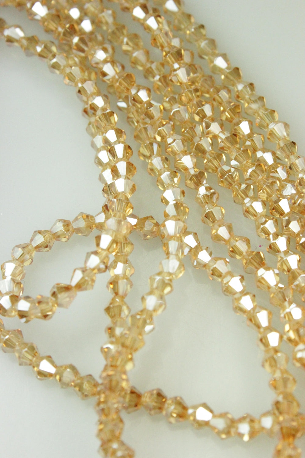 Cristale Biconice, 4mm, (12gr/Sirag), Bej